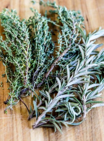 Rosemary and Thyme on cutting board