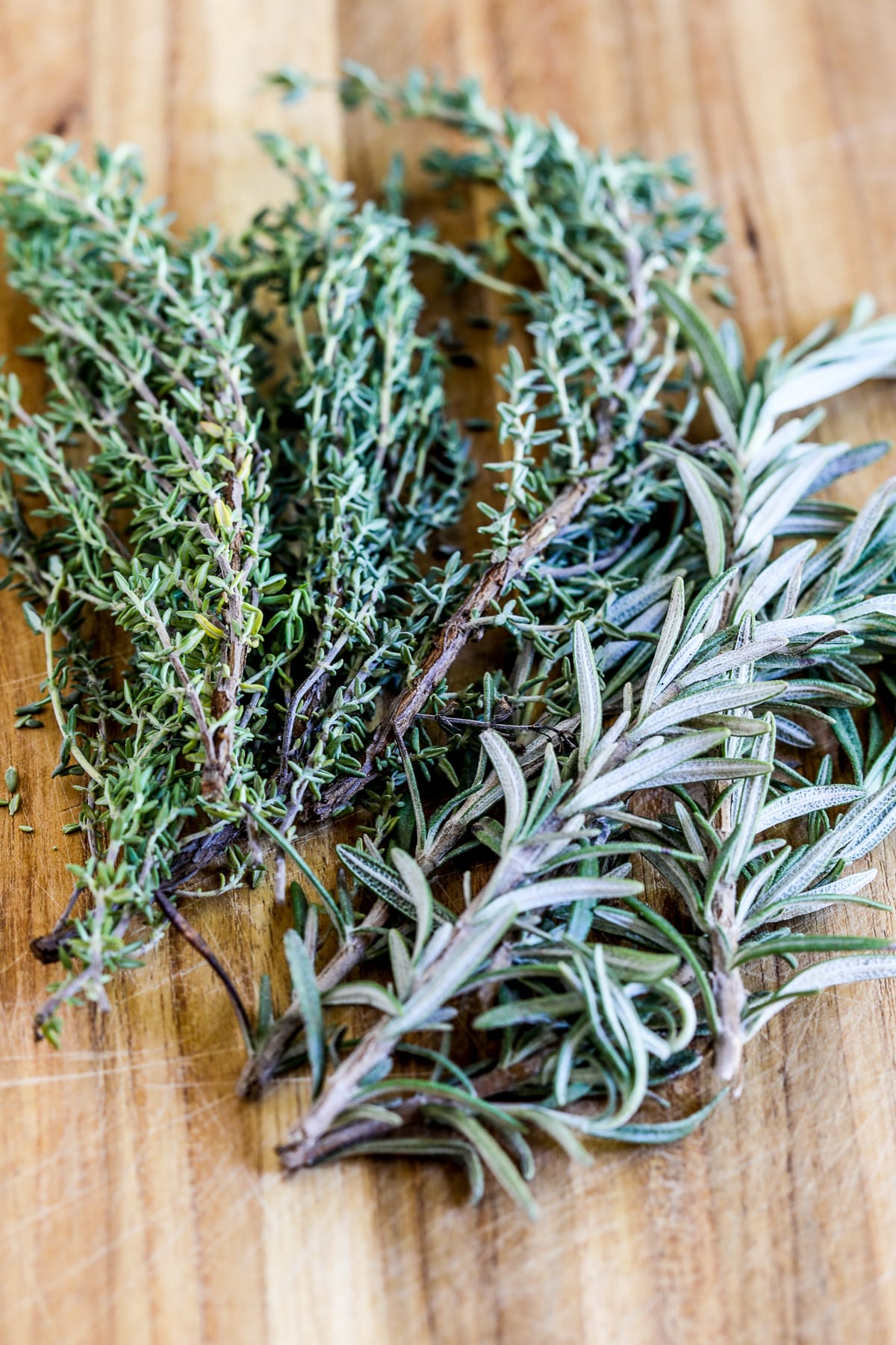 Rosemary and Thyme on cutting board