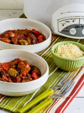 Square image of Slow Cooker Sausage and Peppers in two bowls.