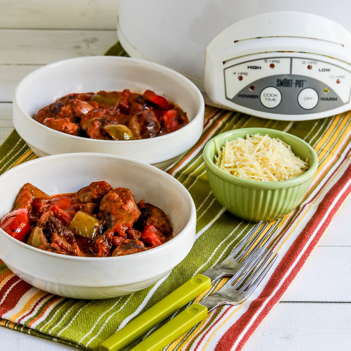 Square image of Slow Cooker Sausage and Peppers in two bowls.