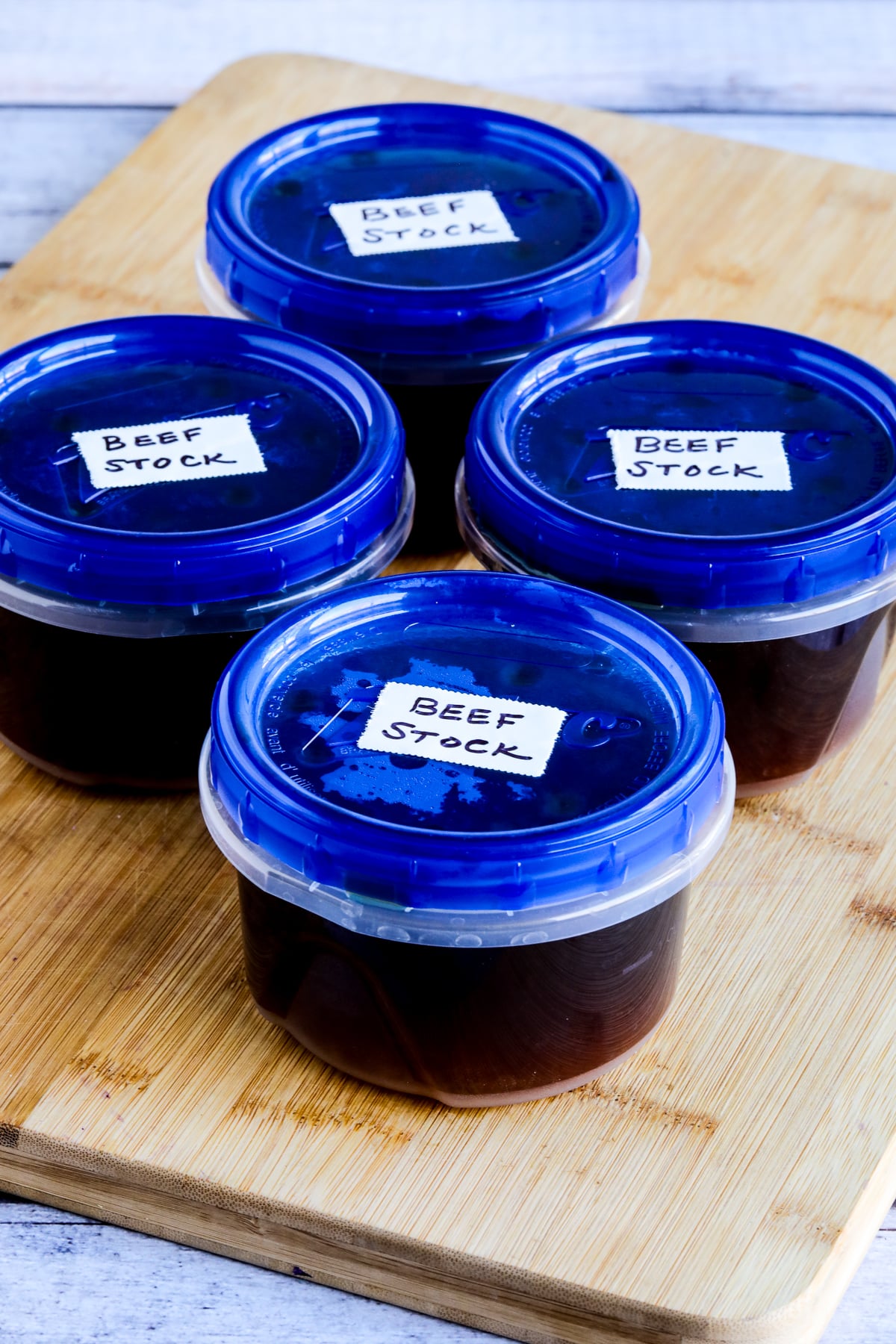How to Make Beef Stock showing stock in freezer containers.