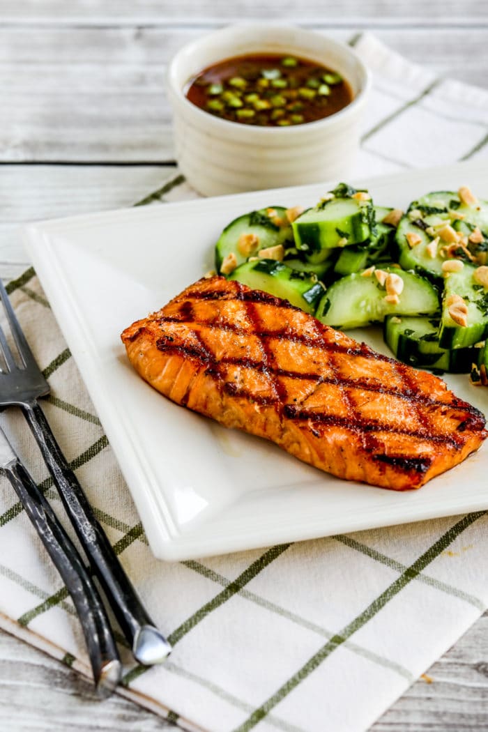 Korean Salmon with Dipping Sauce on serving plate with Thai cucumber salad 