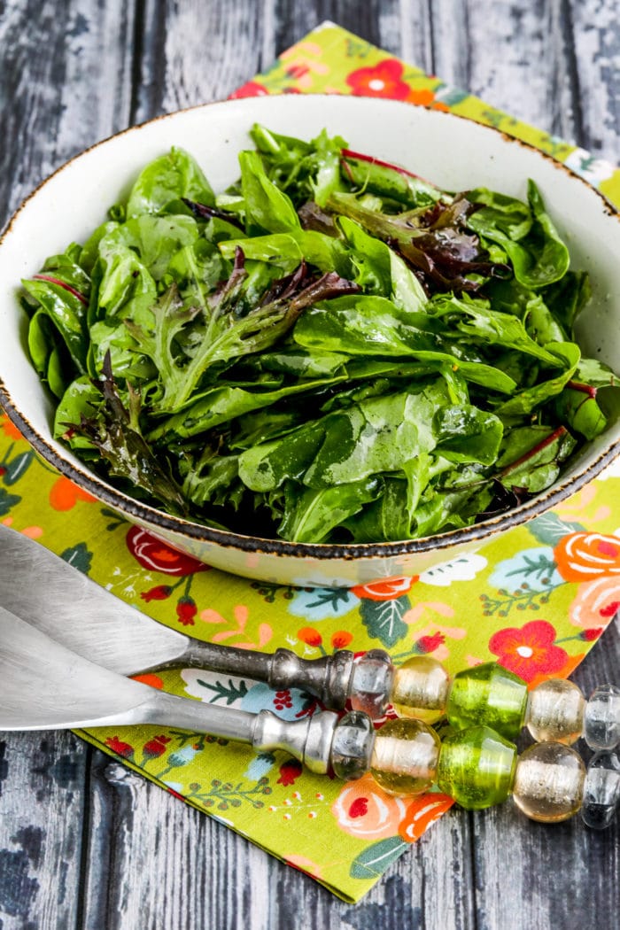 Mary's Perfect Easy Dressing for Spring Mix Salad Greens salad in bowl with two serving forks