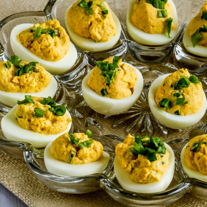 Spicy Deviled Eggs (with Chipotle and Lime) with eggs shown on egg plate.