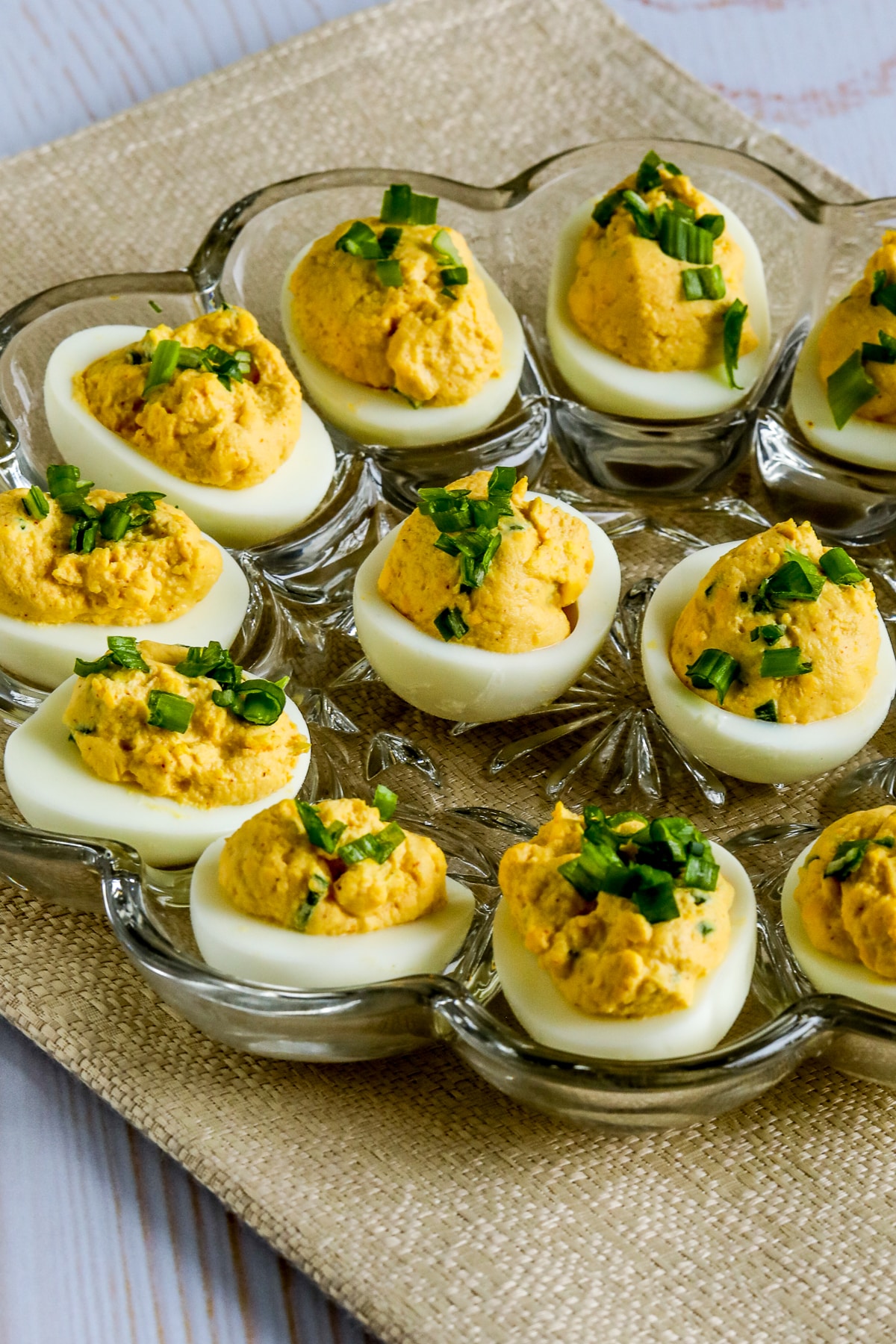 Spicy Deviled Eggs (with Chipotle and Lime) with eggs shown on egg plate.