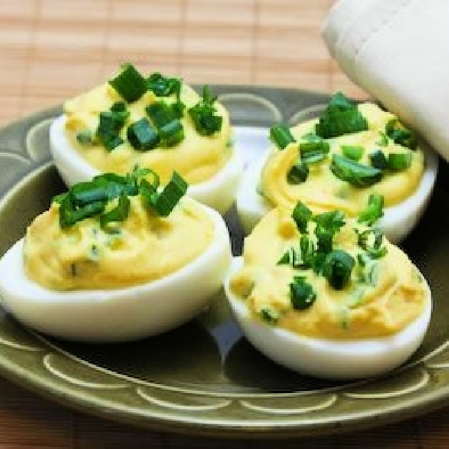 Chipotle-Lime Deviled Eggs show on serving plate with napkin in background