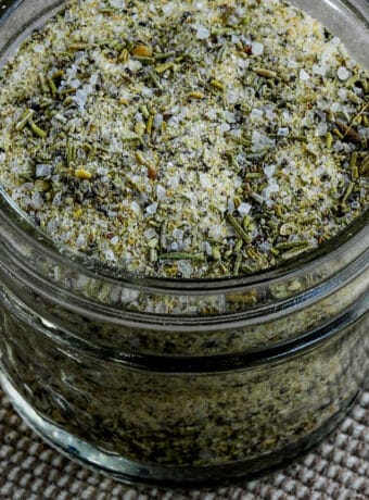 Square image for Rosemary Garlic Seasoning shown in open glass jar.