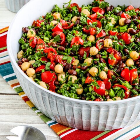 Square image of Balela Salad shown in serving bowl