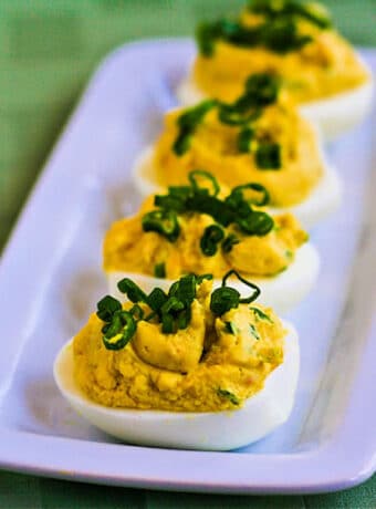 Shrimp Deviled Eggs shown on serving plate.