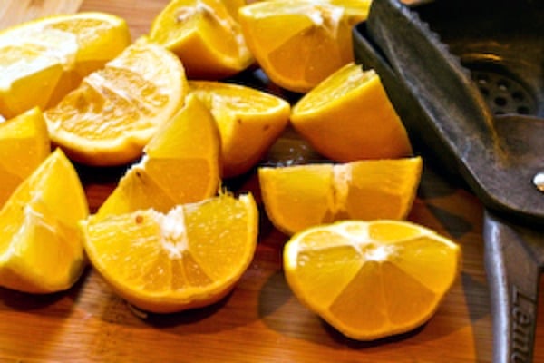 squeezing lemons for Tips for Freezing Fresh Lemon Juice and Lime Juice