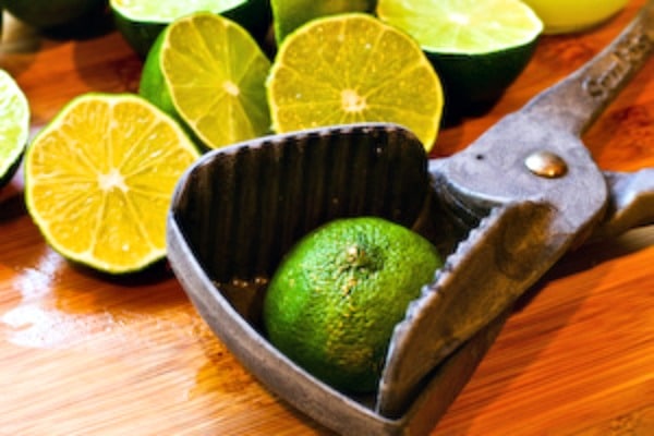 Lime being squeezed for Tips for Freezing Fresh Lemon Juice and Lime Juice
