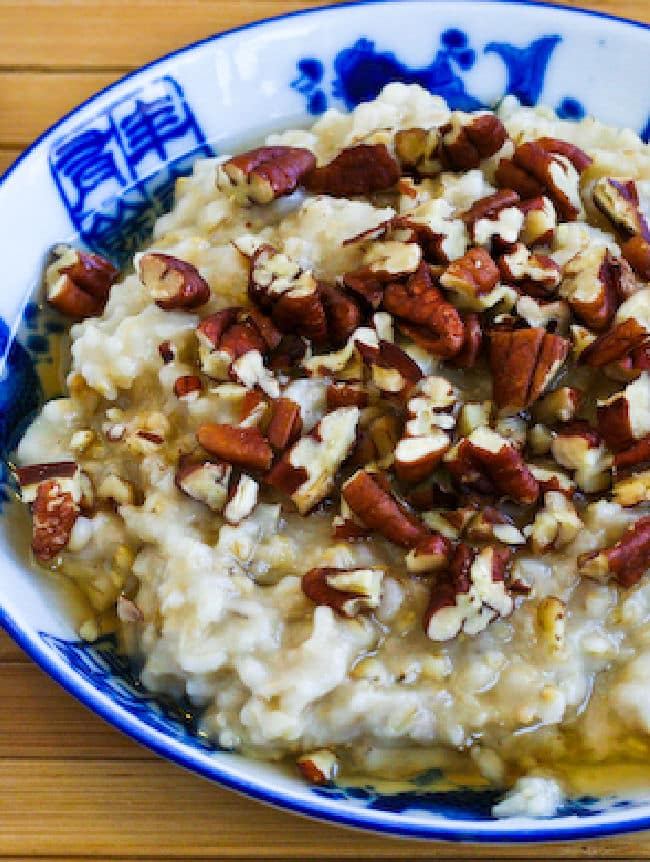 CrockPot Steel Cut Oats with Maple Syrup and Pecans shown in serving bowl.