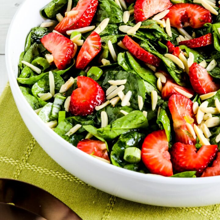 Strawberry Spinach Salad shown in serving bowl.