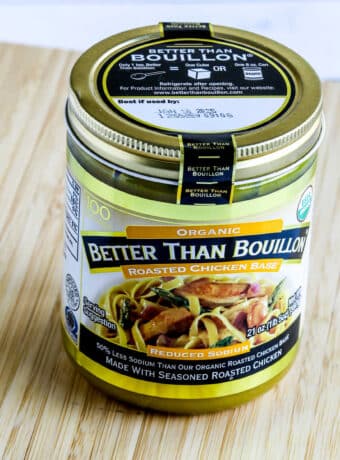 Square image of Better Than Bouillon Organic Low-Sodium Chicken Base jar shown on cutting board.
