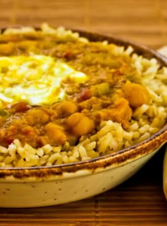 Square image for Moroccan Chickpea Stew shown in serving bowl with napkin.