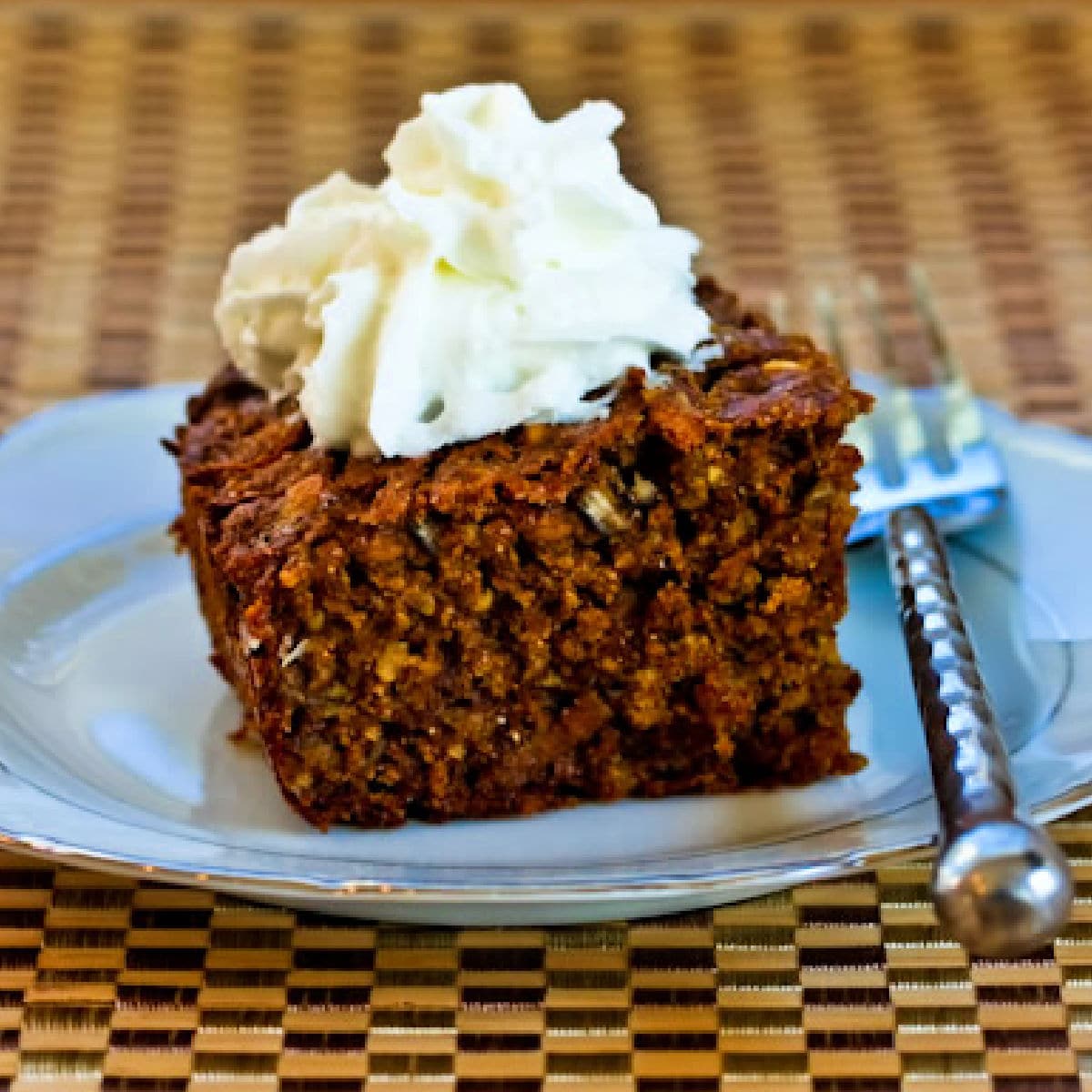 Oatmeal Spice Persimmon Cake shown on plate with fork.