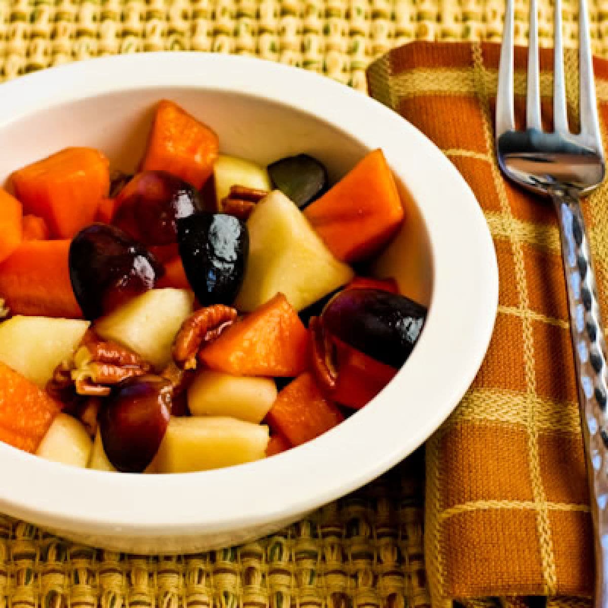 Square image for Persimmon Salad shown with fork and napkin.