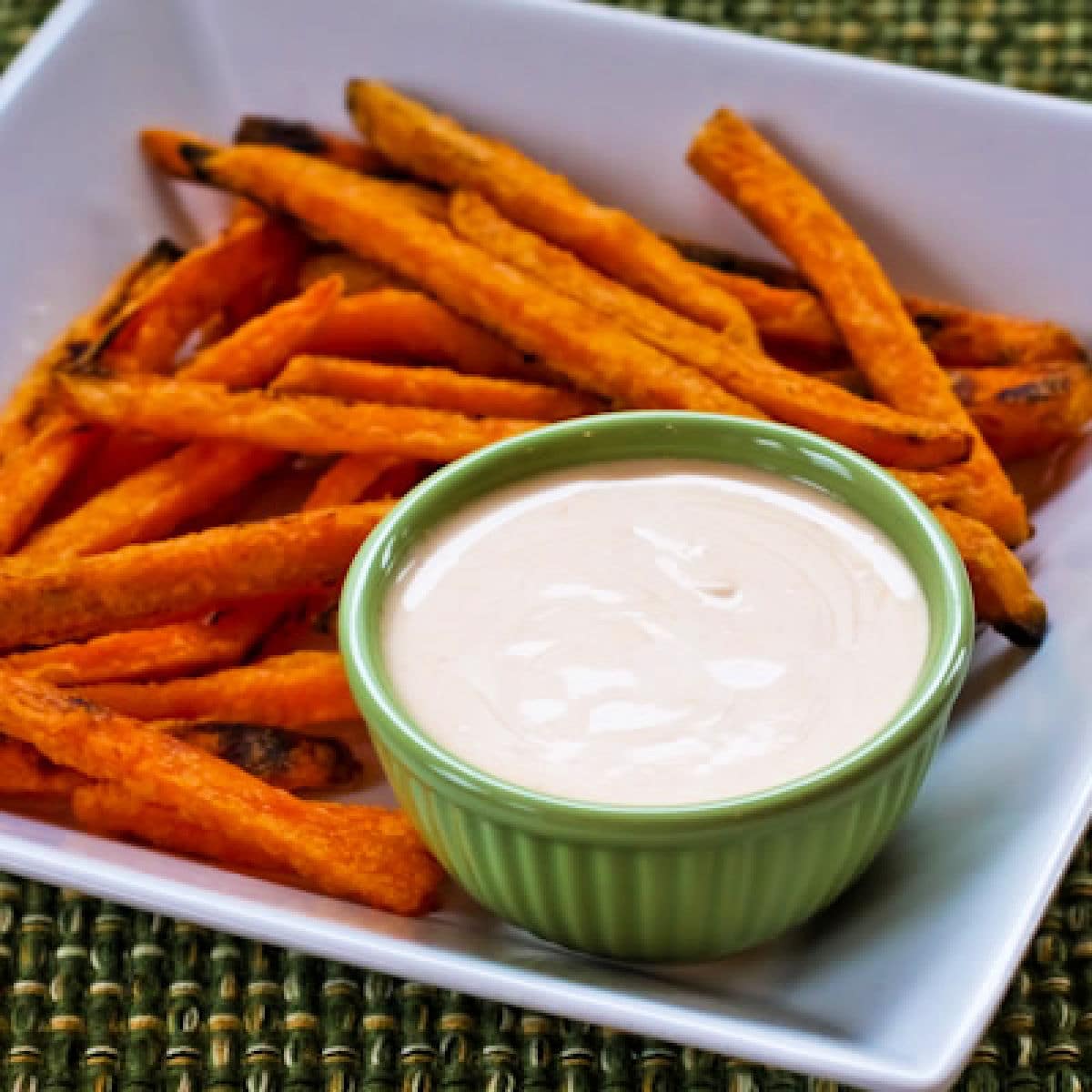 Square image of Sriracha Aioli Dipping Sauce shown with sweet potato fries.