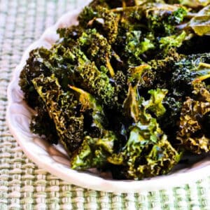 Baked Kale Chips with Salt and Vinegar shown on serving plate.