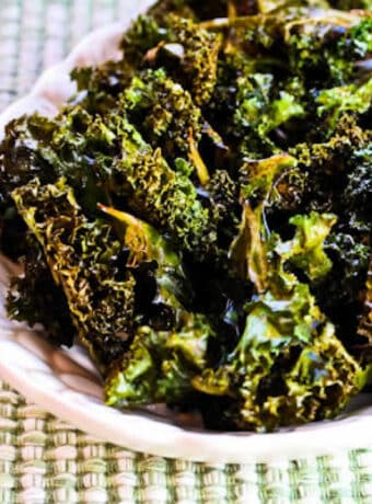 Baked Kale Chips with Salt and Vinegar shown on serving plate.