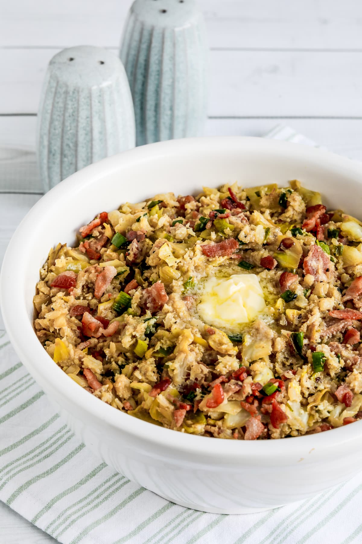 Low-Carb Colcannon Recipe with Bacon shown in serving bowl with pat of butter melting