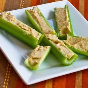 hummus stuffed into celery on plate