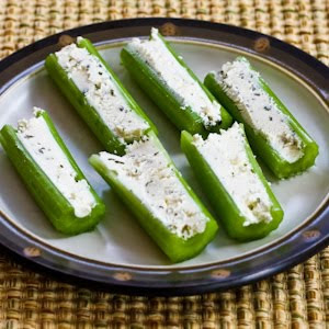 celery stuffed with garlic and herb cheese on plate