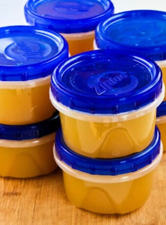 Square image for How to Make Chicken Stock showing stock in containers for freezer.