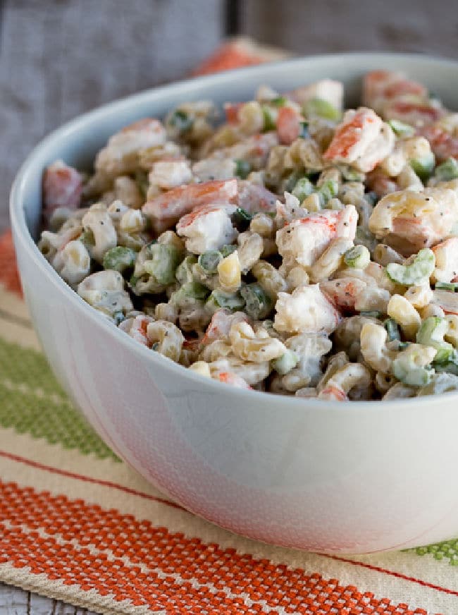 Family Favorite Shrimp and Macaroni Salad shown in serving bowl on napkin.