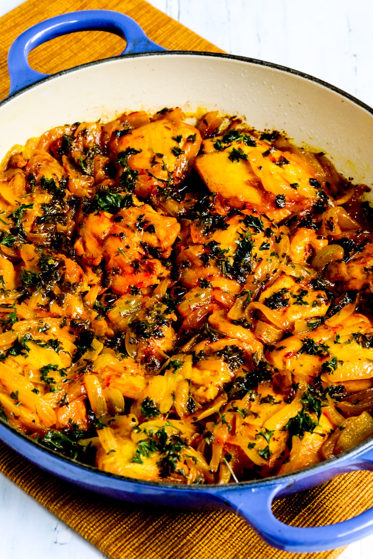 Saffron Chicken with Parsley and Lemon shown in pan it was cooked in.