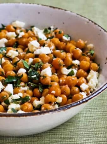 Garlic Roasted Chickpeas with Feta, Mint, and Lemon shown in serving bowl.