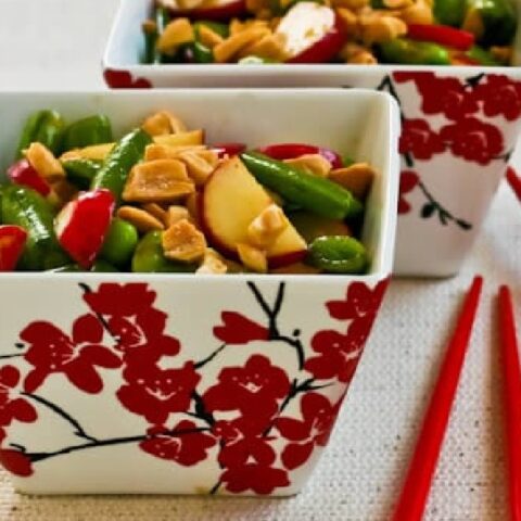 Sugar Snap Pea Salad shown in two cherry blossom bowls with chipsticks