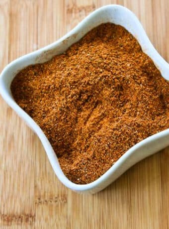 Kalyn's Taco Seasoning Mix shown in square bowl on cutting board.