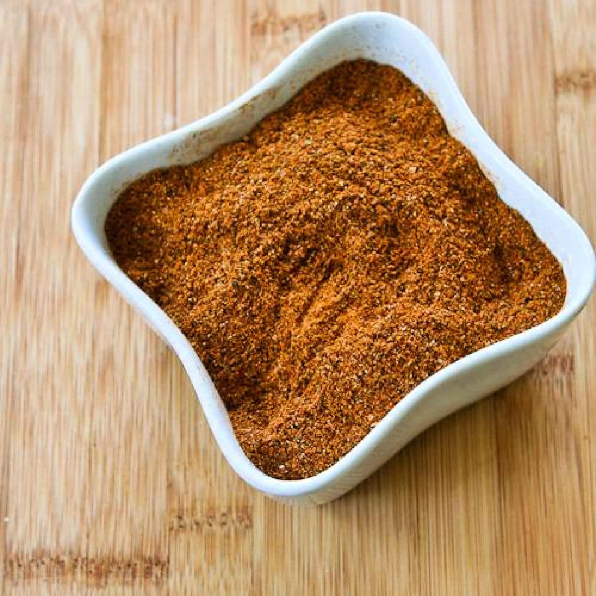 Kalyn's Taco Seasoning Mix shown in square bowl on cutting board.