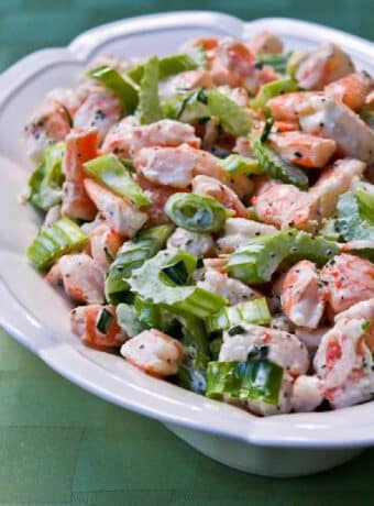 Tarragon Shrimp Salad shown in serving bowl on green napkin