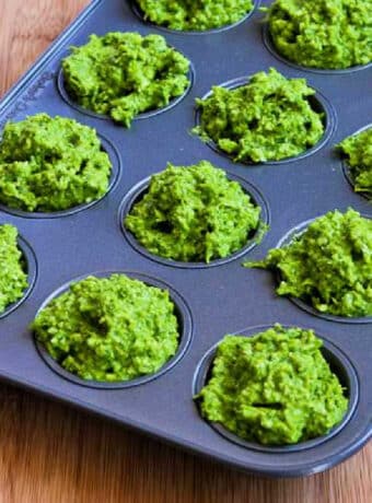 Garlic Scape Pesto with Chard ready to be frozen in mini muffin tin