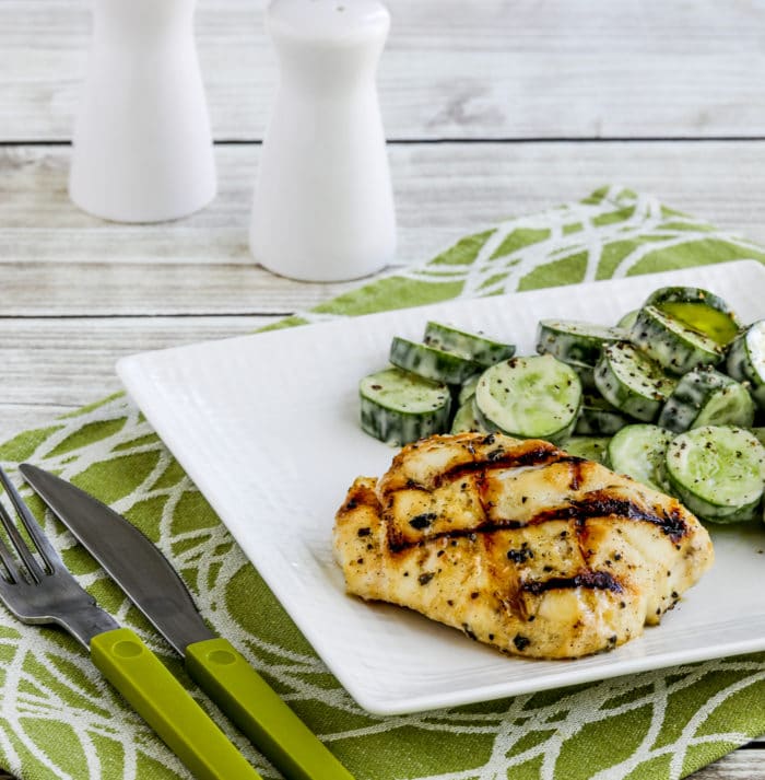 Grilled Cod with Garlic, Basil, and Lemon square image of fish on serving plate with cucumber salad