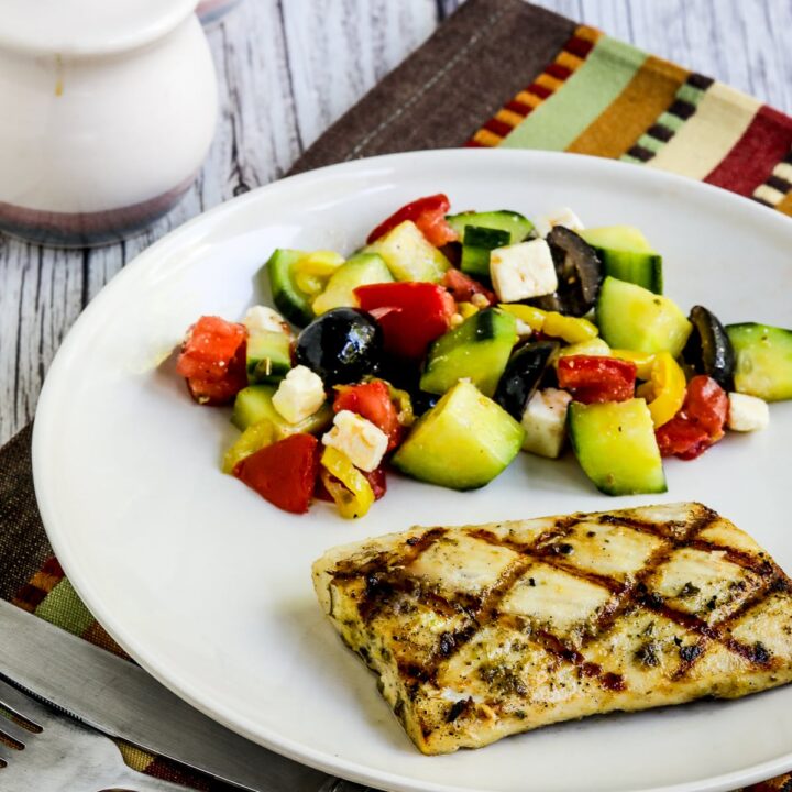 Grilled Fish with Lemon and Capers shown on serving plate with salad.