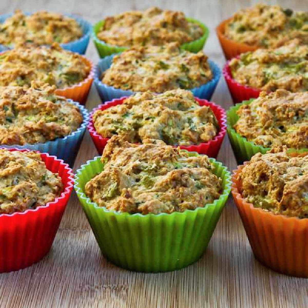 Savory Zucchini Muffins with Green Chiles shown lined up on cutting board