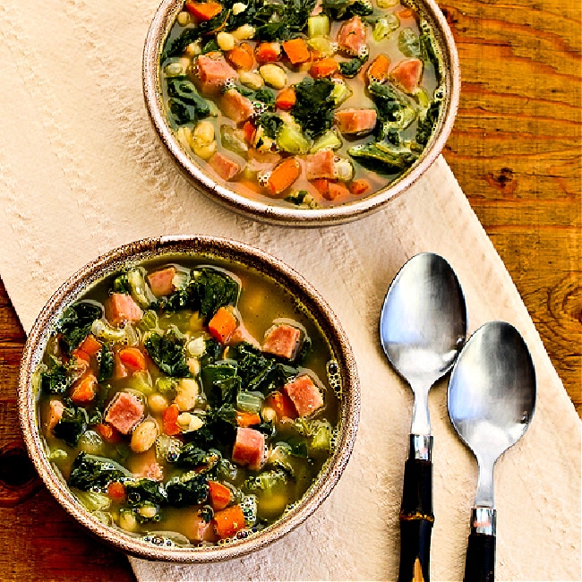 Bean Soup with Ham and Chard. square image of two bowls of soup with spoons