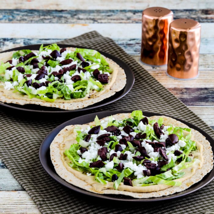 square thumbnail image of Middle Eastern Tostadas with Hummus and Feta on two serving plates