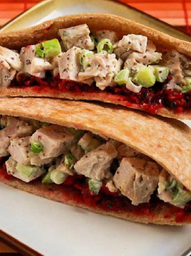 Vertical image for Turkey Pita Sandwiches (with Trina's Cranberry Salsa) showing two pita halves.