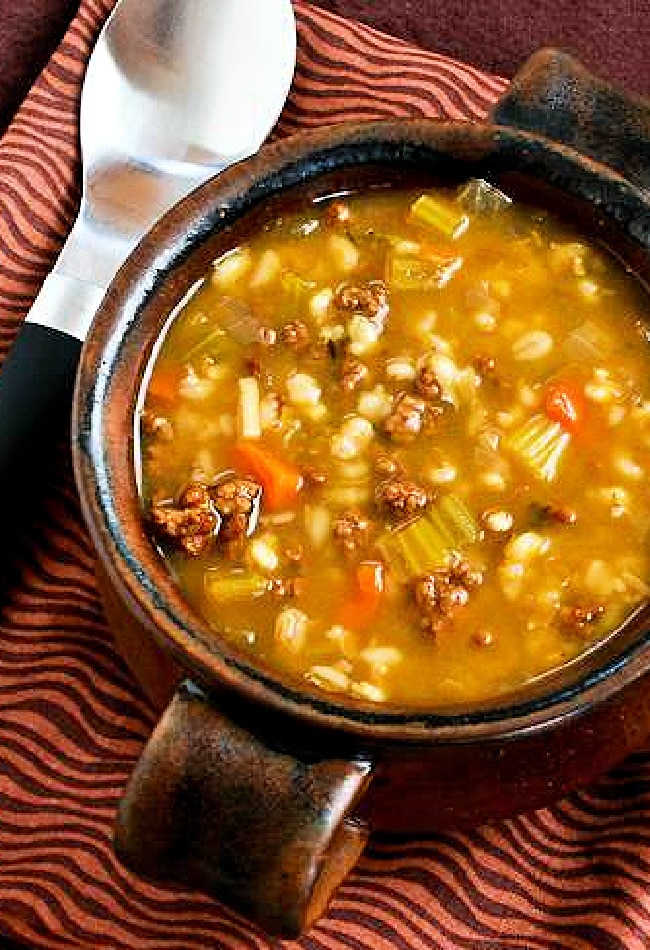 Ground Beef Barley Soup in bowl with spoon