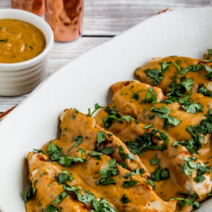 Chicken with Peanut Sauce shown on serving plate with sauce on side
