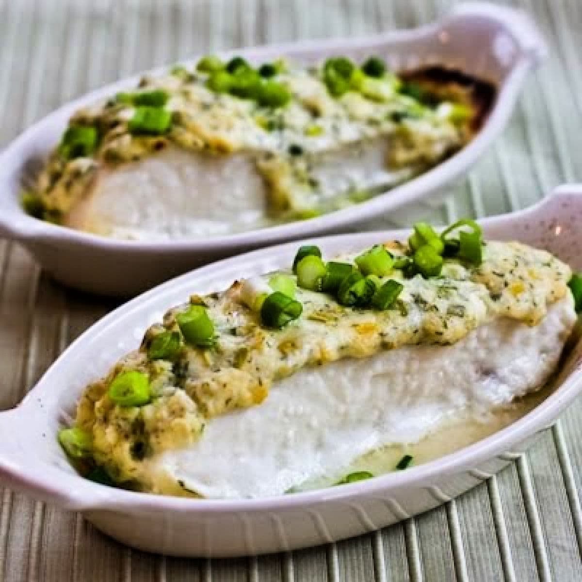 Square image of Baked Halibut with Sour Cream, Parmesan, and Dill Topping shown in two gratin dishes.