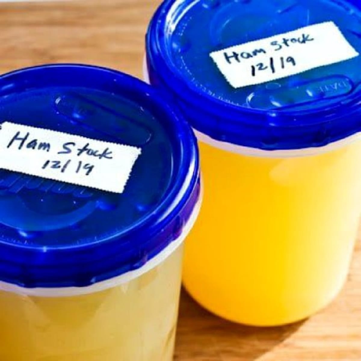Square image of ham stock in containers ready to go into the freezer.