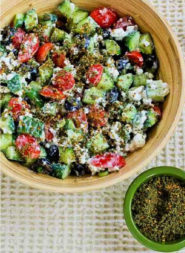Cottage Cheese Salad with Za'atar cropped image with salad in serving bowl and Za'atar on the side.