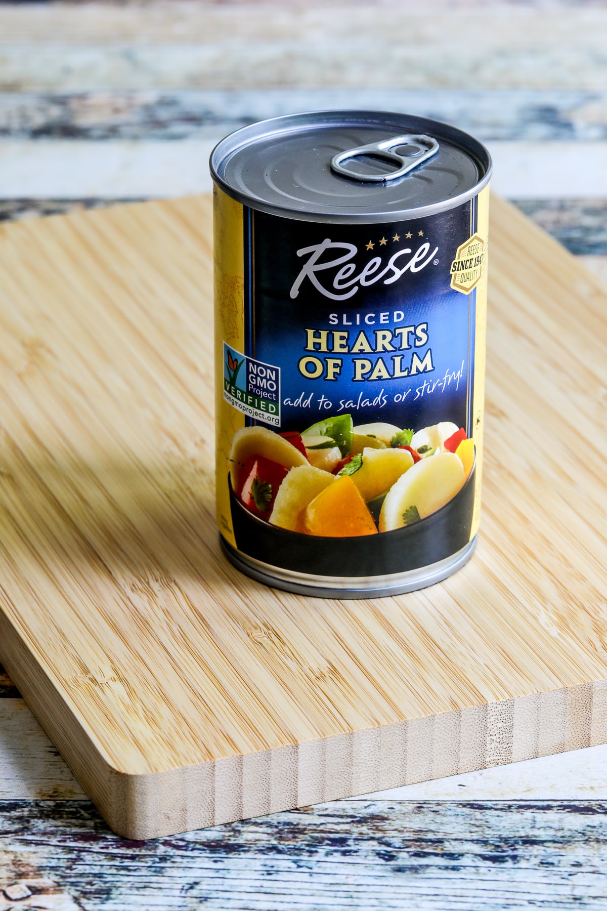 Can of hearts of palm on cutting board