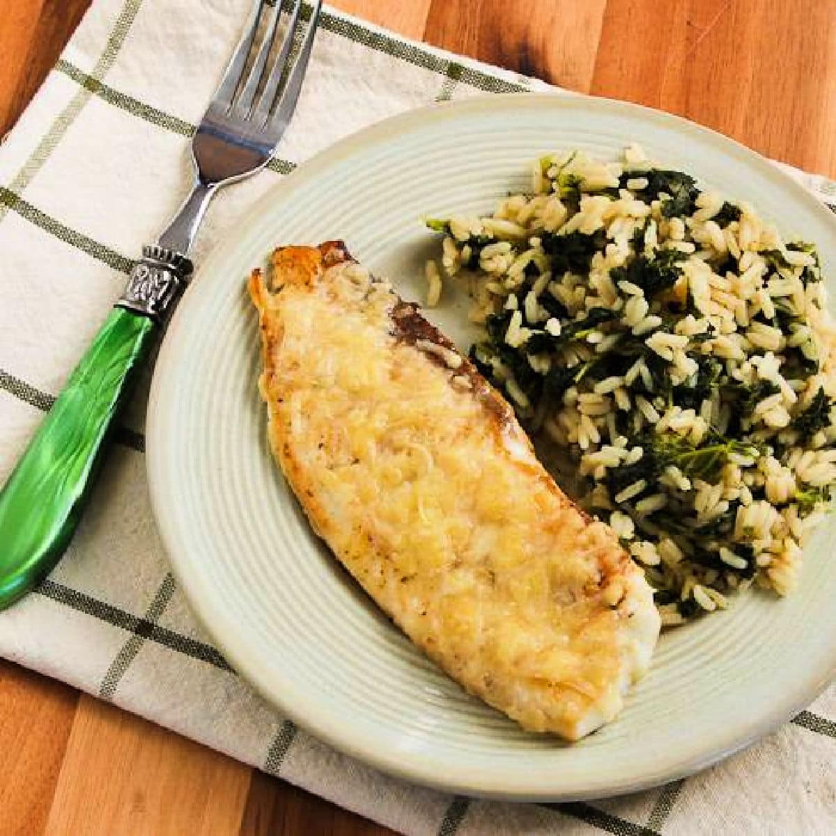 Square image for Parmesan Crusted Fish shown on plate with rice.
