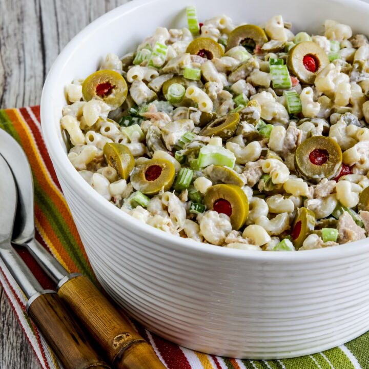 Tuna Macaroni Salad with Green Olives shown in serving bowl with forks.